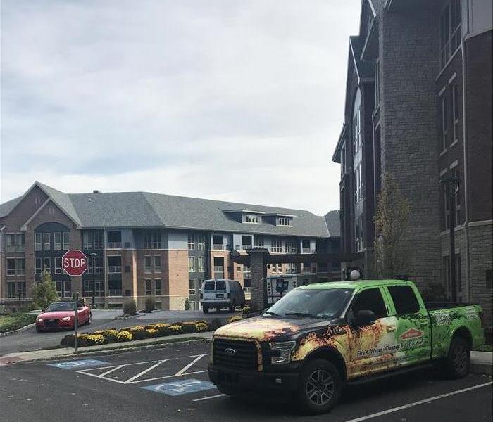 SERVPRO's fleet lining up in front of another water loss